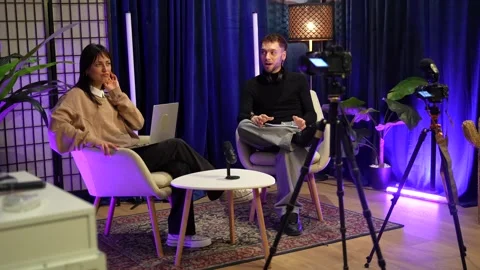 Influencers recording podcast interview in a modern studio Stock Footage 328633671