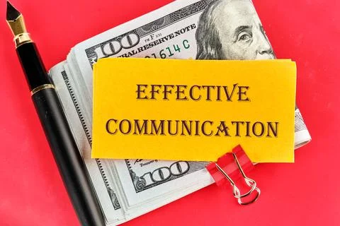 Info concept. EFFECTIVE COMMUNICATION words on yellow paper on dollar bills o Stock Photos