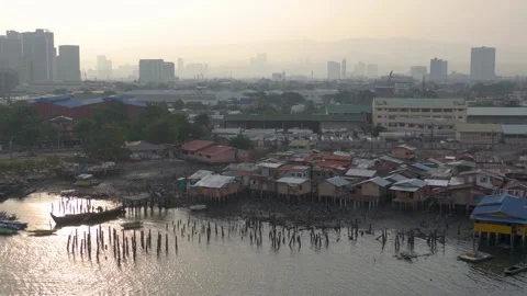 Informal Settlers Under First Mactan Bridge with Hazy Cebu and Mandaue Skyline 動画素材 345970441