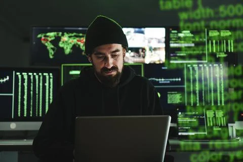 Informatic hacker man coding a internet virus to attack the cyber security Foto stock