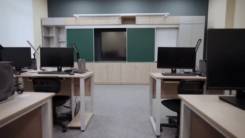 Informatics lab features rows of workstations with computers Stock Footage 333210433