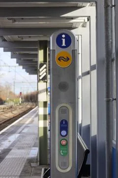 Information and communication unit on platform at train station Nieuwerkerk.. Stock Photos