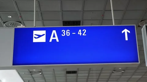 Information board in airport hall with pointer icon, arrow, gate numbers Stock Footage 274536129