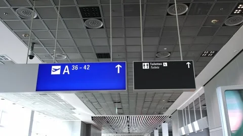 Information boards in airport hall with pointer icons, arrows, gate numbers Stock Footage 274530898