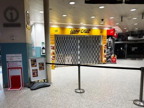 Information desk and closed Upper Crust cafe at a London airport terminal i.. Stock Photos