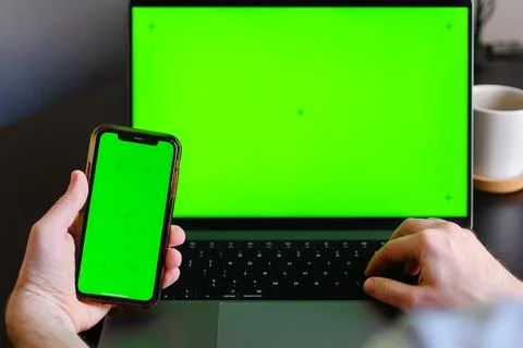 Information or data transfer between mobile phones and laptop, mockup or concept Stock Photos