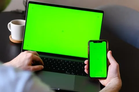 Information or data transfer between mobile phones and laptop, mockup or concept Stock Photos