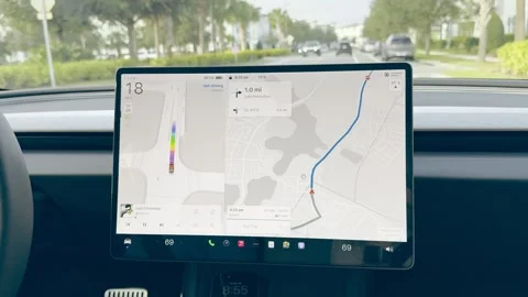 The information screen with a Tesla Santa sleigh and raindeer on a Tesla Stock Footage 324592910
