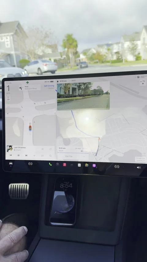 The information screen with a Tesla Santa sleigh and raindeer on a Tesla Stock Footage 324592911