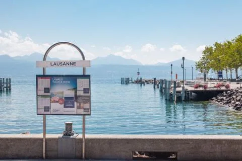 Information sign and timetable post at pier in Lausanne Ouchy port, Switzerla Stock Photos
