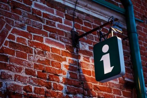 Information sign, light cube on the ancient building. Touristic sign, symbol. Stock Photos