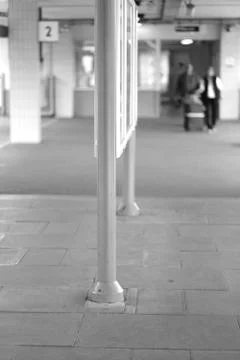 Information stand with a train schedule on the platform of the railway statio Stock Photos