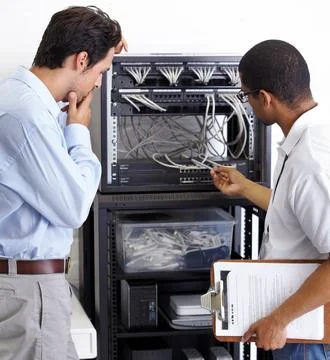 Information technology, men and wire in server room for maintenance, inspection Stock Photos