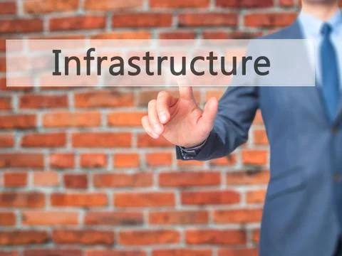 Infrastructure - Businessman hand pressing button on touch screen interface. Stock Photos