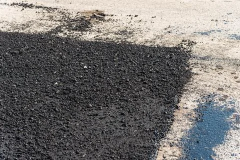 Infrastructure development close-up asphalt paving process at urban constru.. Stock Photos
