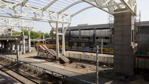 Infrastructure development with curved steel beams and scaffolding at station Stock-Footage 333695877
