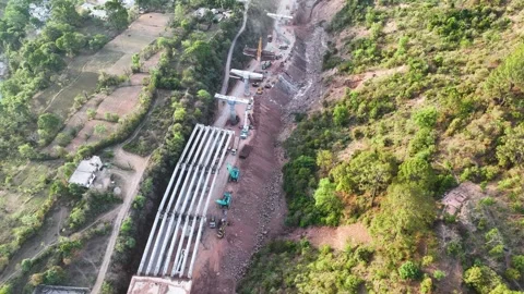 Infrastructure development: New highway cutting through mountains.  Stock Footage 335638981