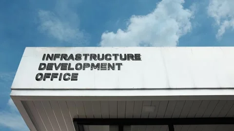 Infrastructure Development Office word sign displayed on building Stock Footage 318701528