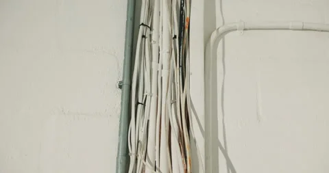 Infrastructure, electrical and data cables on wall for building network, fibre Stock Footage 341460257
