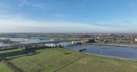 Infrastructure highway bridge over the Lek river, water way and road way. At Stock-Footage 302784034