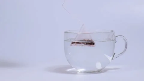 Infuser fruit tea in a transparent cup Stock Footage 147242614