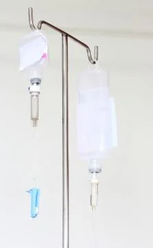 Infusion bottle with iv solution on white background Stock Photos