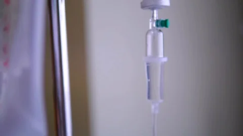 Infusion bottle with saline solution for patient in emergency room Stock Footage 124939614