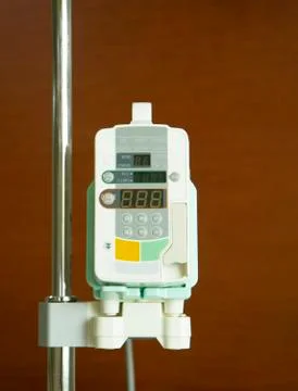 Infusion pump with brown background Stock Photos
