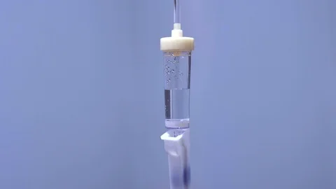 Infusion system drip chamber on a plain background Stock Footage 120123497