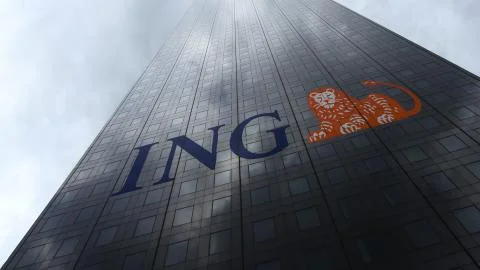 ING Group logo on a skyscraper facade reflecting clouds. Editorial 3D rendering Stock Illustration