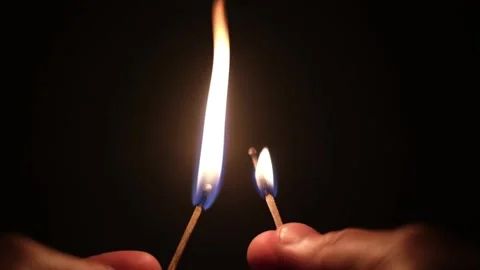 Ingintion of two matches in dark Stock Footage 156855932