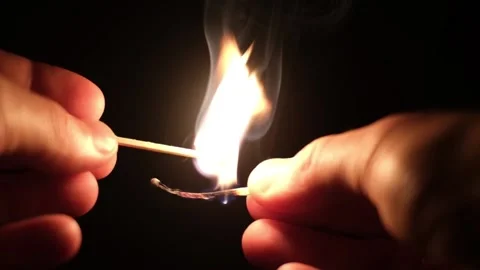 Ingintion of two matches in dark Stock Footage 156856069