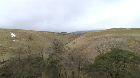Ingleborough Mountain in the distance, dropping between gorge, Drone, Yorkshire Stock-Footage 93248937