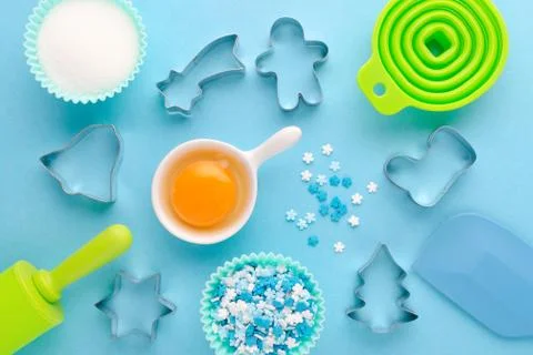 Ingredients and kitchen tools for baking on blue background, flat lay Stock Photos