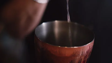 Ingredients are poured into a shaker. Making a cocktail. Stock Footage 252535876