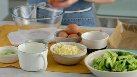 The ingredients are on the table and the egg is placed in a glass bowl for Video stock 146920433