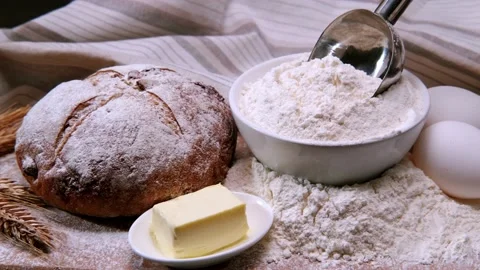 Ingredients for baking bread. Flour, butter eggs and spikelets on the table Stock Footage 202076123