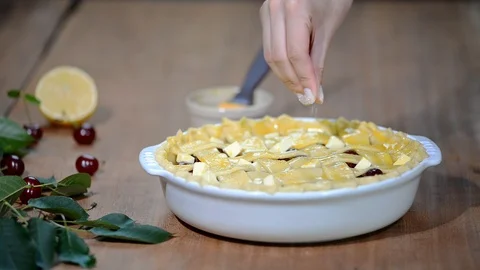 Ingredients for baking cake stuffed with fresh cherry pie. Female preparing Stock Footage 91735144