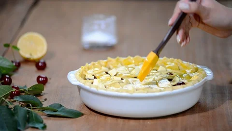 Ingredients for baking cake stuffed with fresh cherry pie. Female preparing Stock Footage 91770515