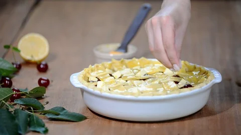 Ingredients for baking cake stuffed with fresh cherry pie. Female preparing Stock Footage 91832753