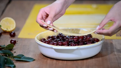 Ingredients for baking cake stuffed with fresh cherry pie. Female preparing Stock Footage 91853041