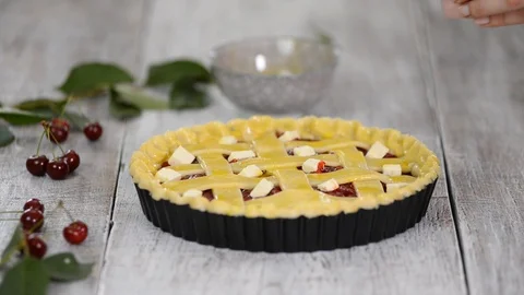 Ingredients for baking cake stuffed with fresh cherry pie. Female preparing Stock Footage 112388109