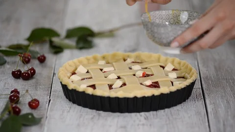 Ingredients for baking cake stuffed with fresh cherry pie. Female preparing Stock Footage 112672051