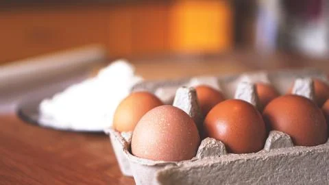 Ingredients for baking homemade bread. Eggs, flour. Wooden background, side.. Foto stock