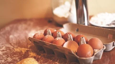 Ingredients for baking homemade bread. Eggs, flour. Wooden background, side.. 스톡 사진