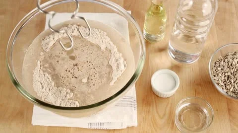 Ingredients for bread dough being kneaded with a food processor Stock Footage 24672959