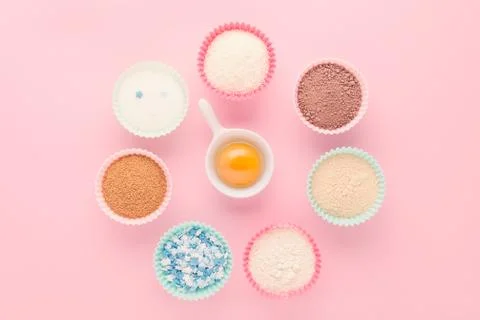 Ingredients like a clock, baking time concept, on pink background Stock Photos