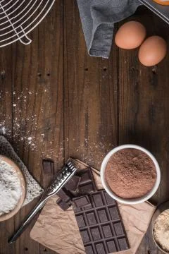 Ingredients to cooking muffins in a rustic setting on wooden table with copys Stock Photos