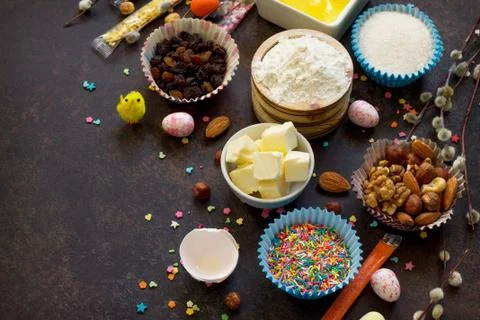 Ingredients for Easter baking - eggs, nuts, flour, yeast, butter, raisins. Foto stock