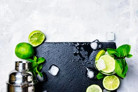 Ingredients for making alcoholic summer cocktail and bar tools, drink backgro Stock Photos